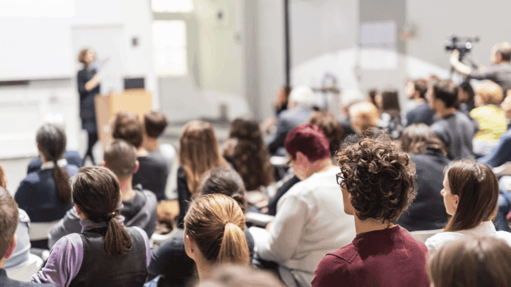 classroom environment with college students taking notes