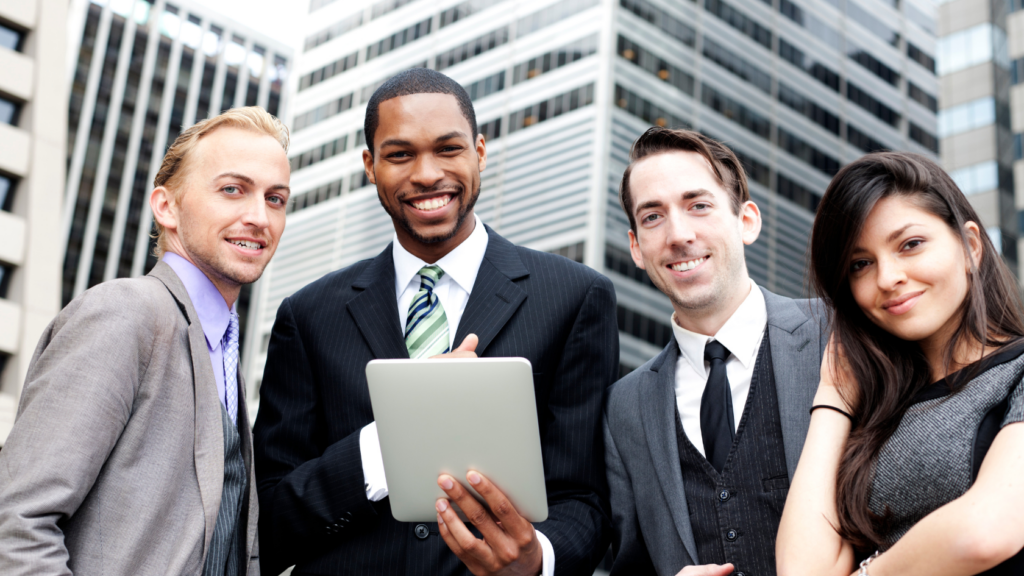 four business professionals with tablet