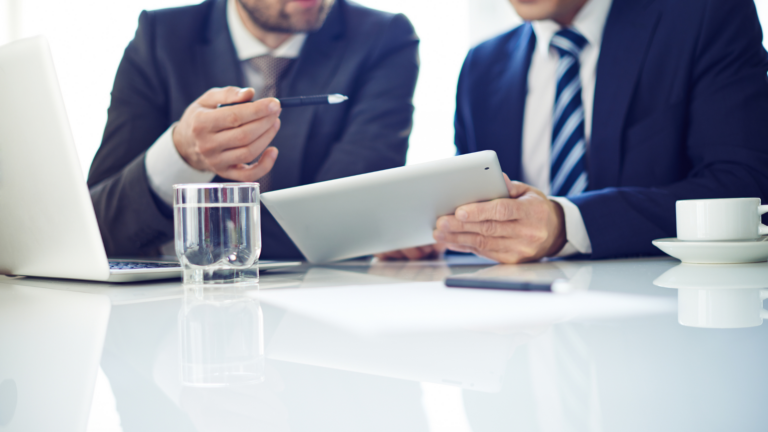 Two legal professionals reviewing California premarital agreement requirement documents